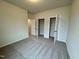 Bedroom featuring carpet floors and two closets with white doors at 108 Commons Circle # 228, Clayton, NC 27520