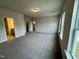 Spacious primary bedroom featuring plush carpeting, natural light, and ensuite bathroom at 108 Commons Circle # 228, Clayton, NC 27520