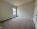 Bright bedroom with a view from the window at 108 Commons Circle # 228, Clayton, NC 27520