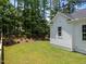 Spacious backyard featuring lush green grass and landscaping for outdoor enjoyment at 1721 Burnette Garden Path, Raleigh, NC 27612