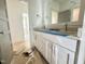 Bathroom featuring double vanity with modern fixtures, ample storage, and a neutral color palette at 1721 Burnette Garden Path, Raleigh, NC 27612