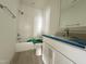 This bathroom features a bathtub with a shower, a toilet, a vanity, and a mirror at 1721 Burnette Garden Path, Raleigh, NC 27612