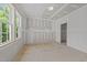 A room under construction with a window overlooking trees and a doorway to another room is ready for customization at 1721 Burnette Garden Path, Raleigh, NC 27612