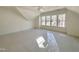 This spacious bedroom features large windows, creating a bright and airy atmosphere, ideal for relaxation at 1721 Burnette Garden Path, Raleigh, NC 27612