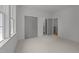 Bedroom with bright windows and neutral carpet at 1721 Burnette Garden Path, Raleigh, NC 27612