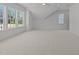 Bonus room with neutral carpet, ceiling fan and a vaulted ceiling at 1721 Burnette Garden Path, Raleigh, NC 27612