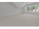 Bonus room with neutral carpet, ceiling fan and a vaulted ceiling at 1721 Burnette Garden Path, Raleigh, NC 27612