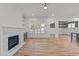 Living room with fireplace and open access to the dining room and kitchen at 1721 Burnette Garden Path, Raleigh, NC 27612