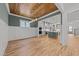 Open-concept living room flows into the kitchen with stainless appliances and island seating at 1721 Burnette Garden Path, Raleigh, NC 27612