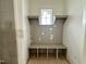 Mudroom with gray built-in bench and storage, offering a stylish and organized entry point to the home at 1721 Burnette Garden Path, Raleigh, NC 27612