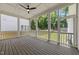 Relaxing screened porch with wooden floors, ceiling fan, and a view of the backyard at 1721 Burnette Garden Path, Raleigh, NC 27612