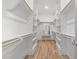 Spacious walk-in closet with custom shelving and center bench at 1721 Burnette Garden Path, Raleigh, NC 27612