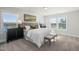 Bright bedroom with a large bed, neutral tones, and natural light streaming through the windows at 211 Pond View Ct # 5, Fuquay Varina, NC 27526