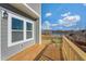 A spacious wooden deck offers scenic views of the calm lake, creating a serene outdoor retreat at 211 Pond View Ct # 5, Fuquay Varina, NC 27526