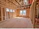 The unfinished interior displays stud framing, window placement, and the potential for a spacious, light-filled room at 211 Pond View Ct # 5, Fuquay Varina, NC 27526