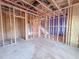 Spacious unfinished interior with exposed framing, electrical wiring, and stairwell at 211 Pond View Ct # 5, Fuquay Varina, NC 27526