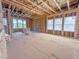 An open, unfinished interior features the framing for windows and exposed studs, showcasing the potential of a new build at 211 Pond View Ct # 5, Fuquay Varina, NC 27526