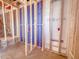 Interior view of a new construction home's framing, showcasing wall studs and preparation for electrical and plumbing systems at 211 Pond View Ct # 5, Fuquay Varina, NC 27526
