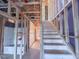 An interior view of a staircase and the framing of a new construction home, including the location of a bathroom at 211 Pond View Ct # 5, Fuquay Varina, NC 27526