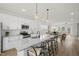 Modern kitchen features a large granite island with seating, stainless steel appliances, and open layout to the living area at 211 Pond View Ct # 5, Fuquay Varina, NC 27526