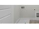 Clean and well-organized laundry room with modern utility connections and durable flooring at 211 Pond View Ct # 5, Fuquay Varina, NC 27526