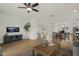 Open-concept living room features a decorative entertainment center, dining area, and modern furniture at 211 Pond View Ct # 5, Fuquay Varina, NC 27526