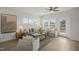 Bright and airy living room with stylish furniture, neutral tones, and abundant natural light for relaxation at 211 Pond View Ct # 5, Fuquay Varina, NC 27526