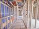 Unfinished hallway with wood framing and exposed ductwork, offering a blank canvas for personalized design at 211 Pond View Ct # 5, Fuquay Varina, NC 27526
