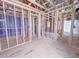 Spacious unfinished interior with exposed wood framing and ductwork, awaiting customization and final touches at 211 Pond View Ct # 5, Fuquay Varina, NC 27526