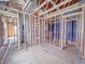 Large unfinished interior with wood framing and exposed pipes, providing a blank canvas for personalization and design at 211 Pond View Ct # 5, Fuquay Varina, NC 27526