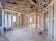 Spacious unfinished interior with wood framing, offering a blank canvas for custom design and finishing touches at 211 Pond View Ct # 5, Fuquay Varina, NC 27526