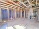 Spacious unfinished interior featuring wood framing and exposed ductwork, ready for customization and finishing touches at 211 Pond View Ct # 5, Fuquay Varina, NC 27526