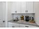 Elegant wet bar area features granite countertops, stylish cabinetry, and modern fixtures at 211 Pond View Ct # 5, Fuquay Varina, NC 27526