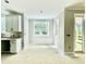 Bright breakfast nook adjacent to the kitchen with large windows and access to the back porch at 2624 Silver Gate Ct, Wake Forest, NC 27587