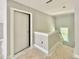 Bright upstairs hallway with natural light from window highlighting the staircase and trim at 2624 Silver Gate Ct, Wake Forest, NC 27587