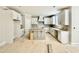 Spacious kitchen features white cabinets, a gray kitchen island and unfinished flooring at 2624 Silver Gate Ct, Wake Forest, NC 27587