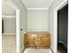 Bathroom vanity with wood cabinets and a quartz countertop in a neutral palette at 2624 Silver Gate Ct, Wake Forest, NC 27587
