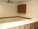 This living room has neutral-toned walls, a ceiling fan, and access to the bar counter at 608 N Ellis Ave, Dunn, NC 28334