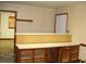 The living room includes built-in features such as a bar counter and wooden cabinets at 608 N Ellis Ave, Dunn, NC 28334