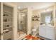 Tastefully designed bathroom featuring a glass-enclosed shower, vanity, and storage shelving at 3177 Armeria Dr, Apex, NC 27502