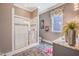 Elegant bathroom featuring a glass-enclosed shower, marble countertop, and stylish fixtures at 3177 Armeria Dr, Apex, NC 27502