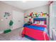 Inviting bedroom featuring Lego wall decor, soft carpet, and ample space for play and relaxation at 3177 Armeria Dr, Apex, NC 27502