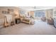 Spacious bedroom with neutral tones, large windows, and stylish furnishings for a relaxing retreat at 3177 Armeria Dr, Apex, NC 27502
