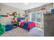 Charming bedroom featuring playful Lego-themed decor and a comfortable blue bed, perfect for children at 3177 Armeria Dr, Apex, NC 27502