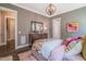 Tastefully decorated bedroom featuring soft lighting and dresser at 3177 Armeria Dr, Apex, NC 27502