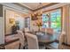 This dining room has a round wood table, six chairs, and modern chandelier lighting at 3177 Armeria Dr, Apex, NC 27502