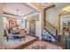 Elegant dining room features stylish chandelier, round table with six chairs, and an arched mirror at 3177 Armeria Dr, Apex, NC 27502