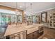 Gourmet kitchen boasts a large island, stainless steel appliances, and open layout, perfect for entertaining guests at 3177 Armeria Dr, Apex, NC 27502