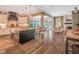 Open-concept kitchen with island, stainless appliances, and view of dining and living areas at 3177 Armeria Dr, Apex, NC 27502