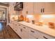 Modern kitchen features sleek white cabinets, a designer backsplash, and high-end appliances at 3177 Armeria Dr, Apex, NC 27502